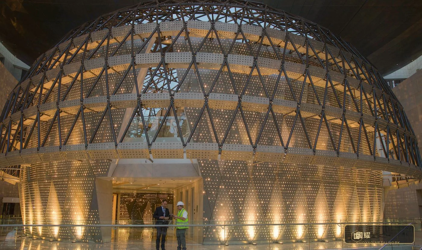 Client representative and engineer inspecting the light effect beneath a completed museum dome
