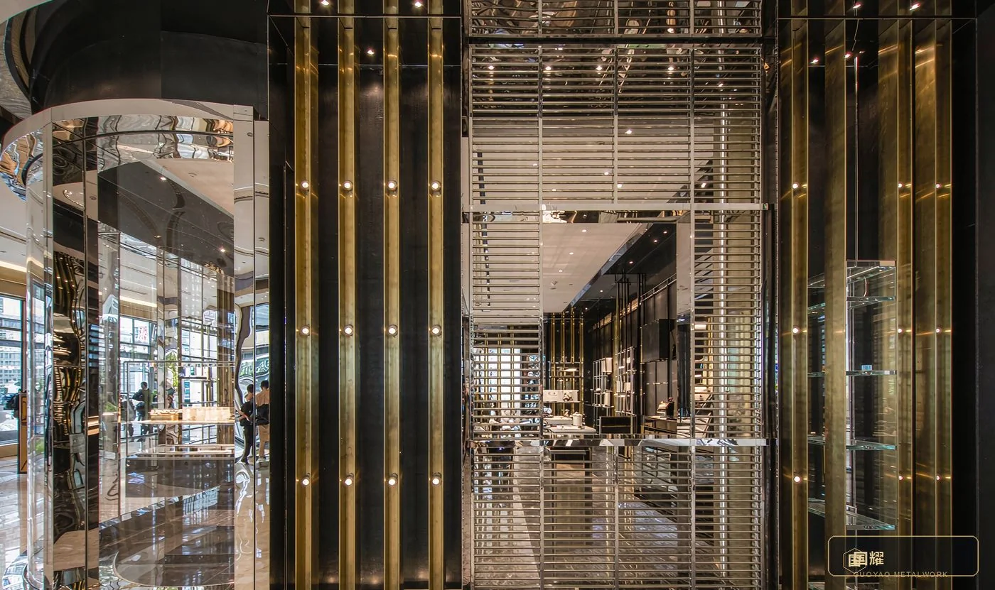 Luxury retail facade in the field: 8K mirror stainless steel and brass trim, distortion-free under spotlights