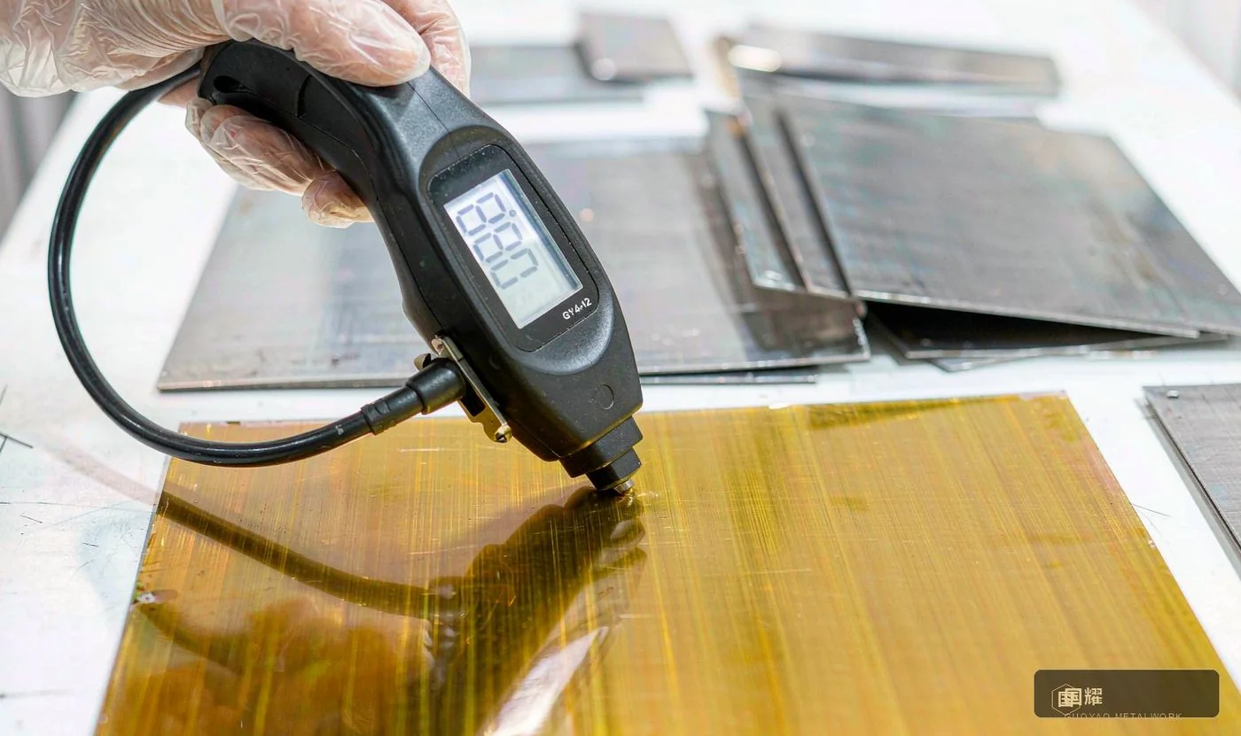 Close-up of a coating thickness gauge measuring a PVD layer