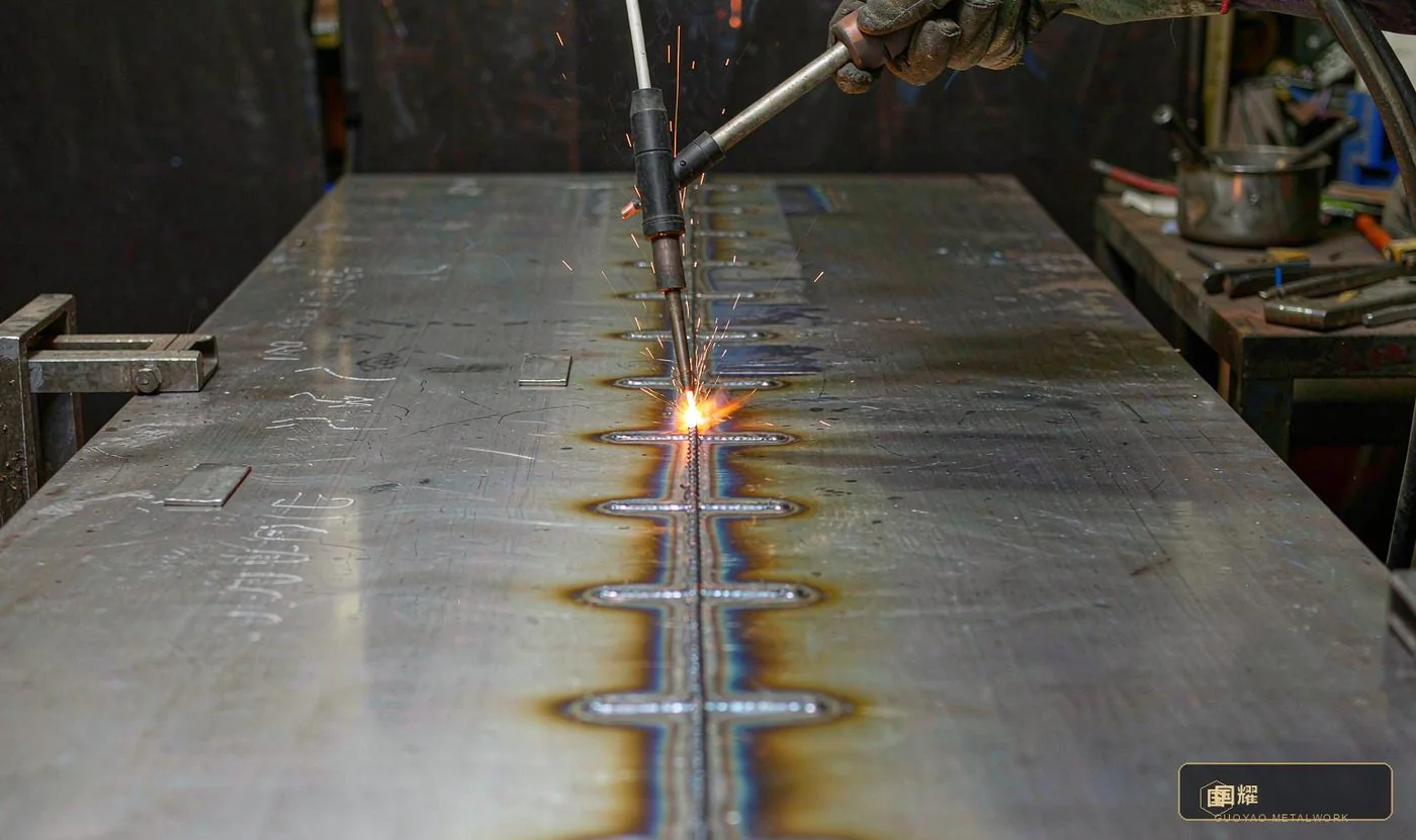 Skip welding on a long seam: welded and unwelded runs alternate