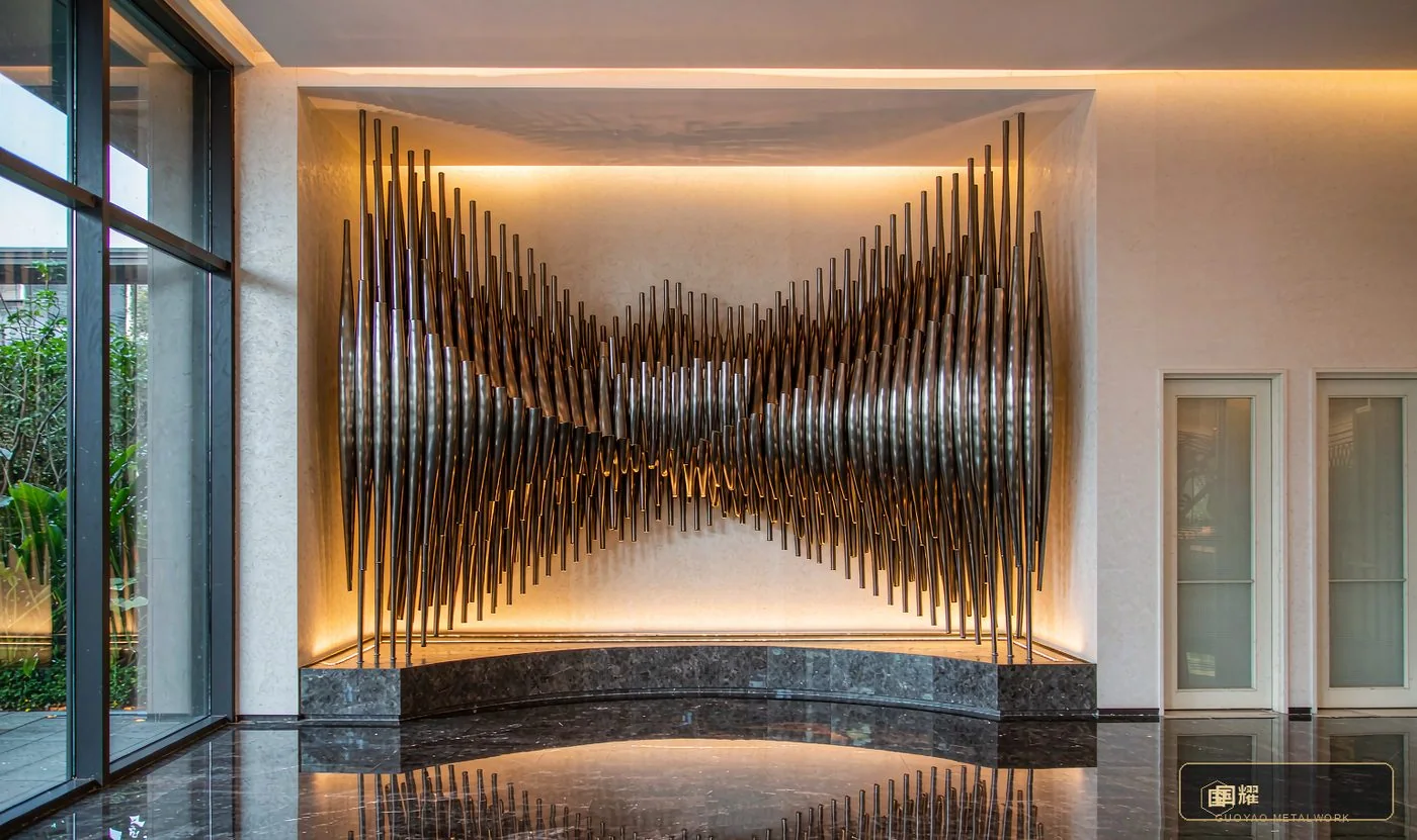 Large-scale metal art installation in a luxury hotel lobby