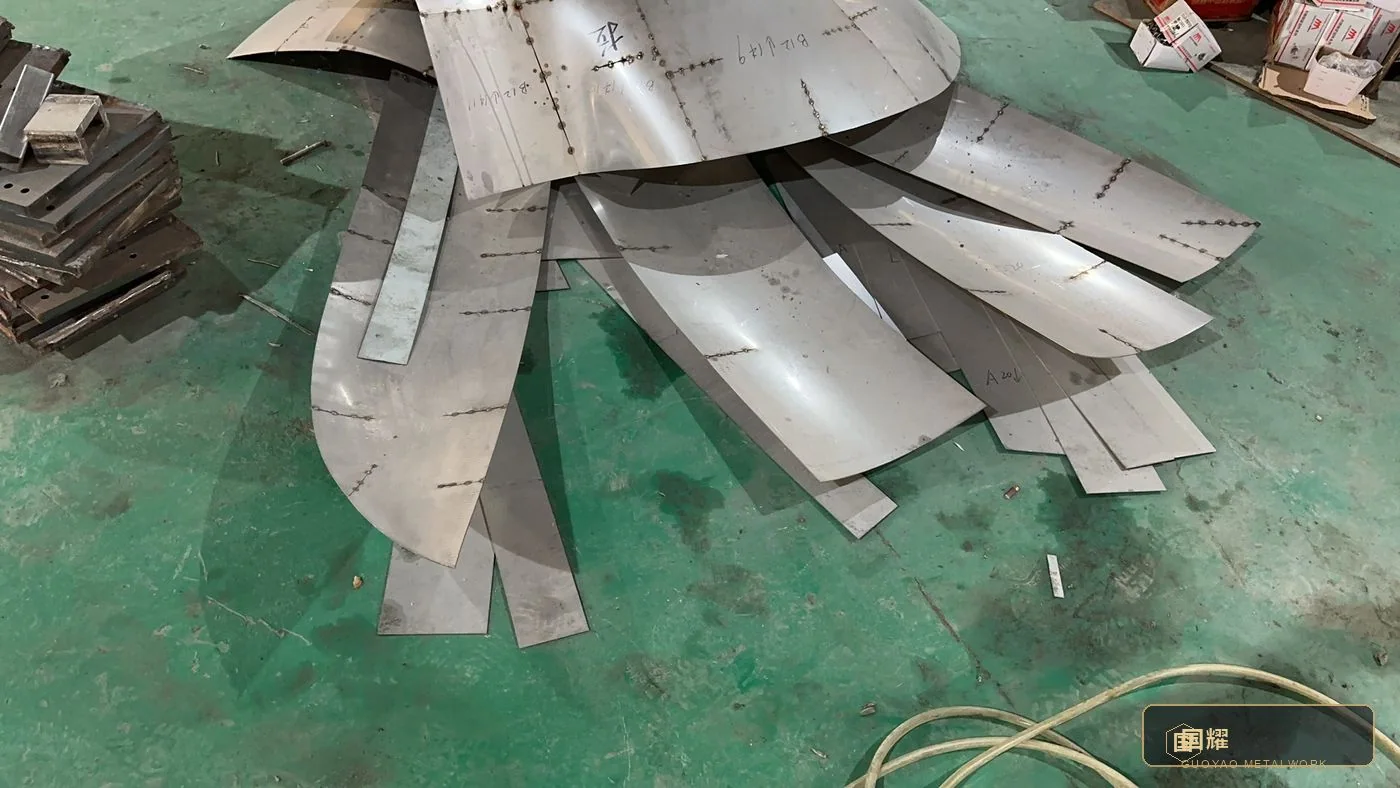 Curved segments resting against the fabrication racks