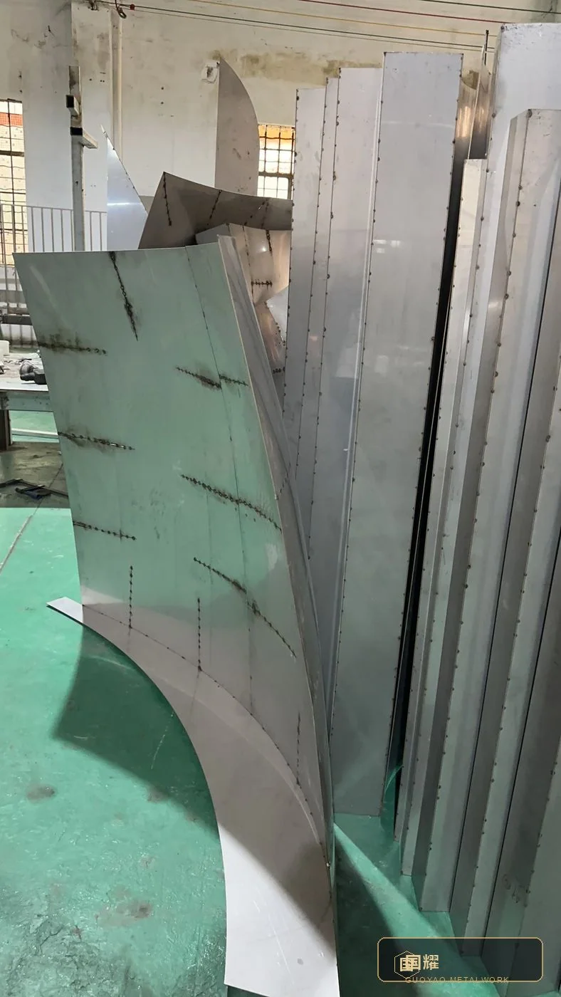 Curved strip segments stood upright for handling