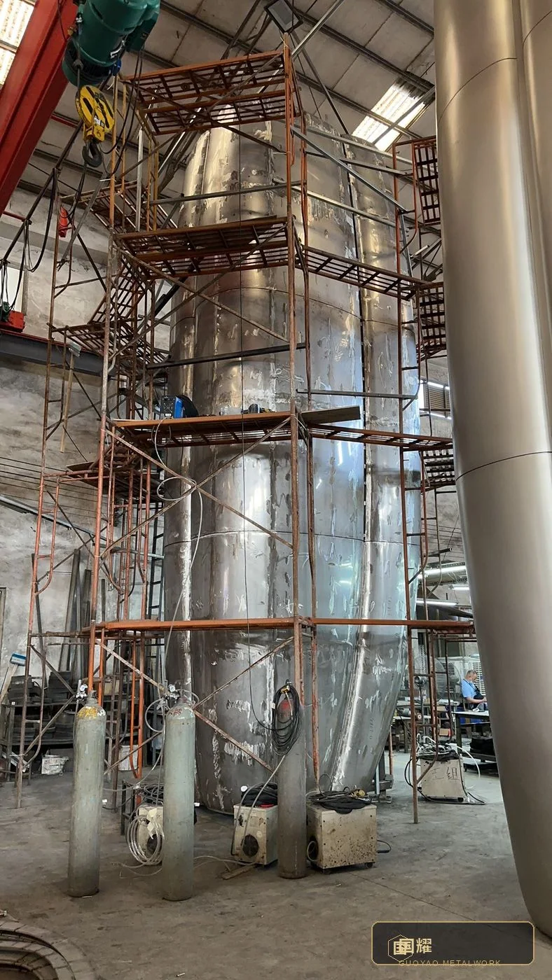 A segment stood against the scaffold during assembly