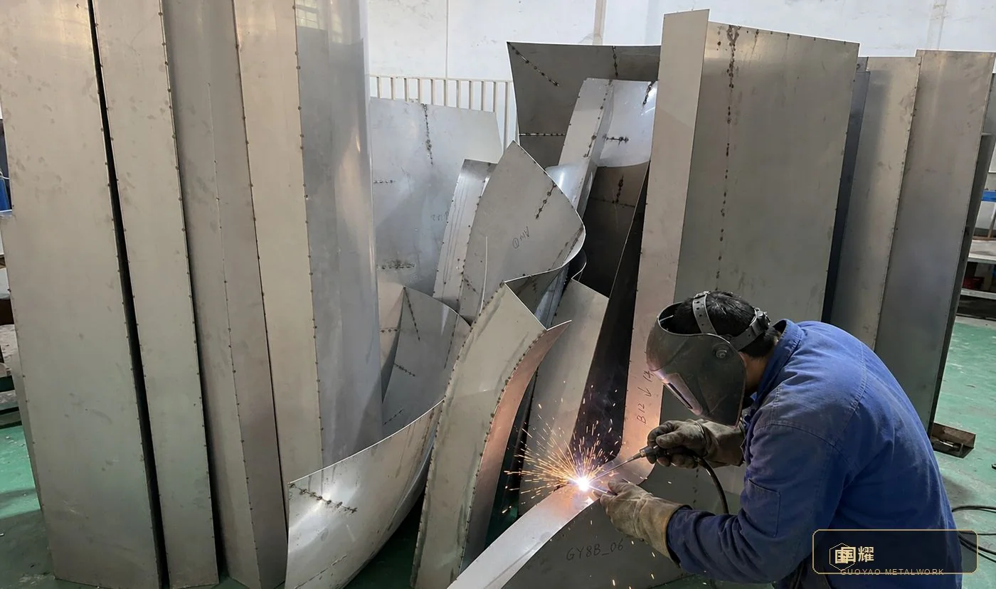 TIG welding the longitudinal joint between two curved panels on a fixture