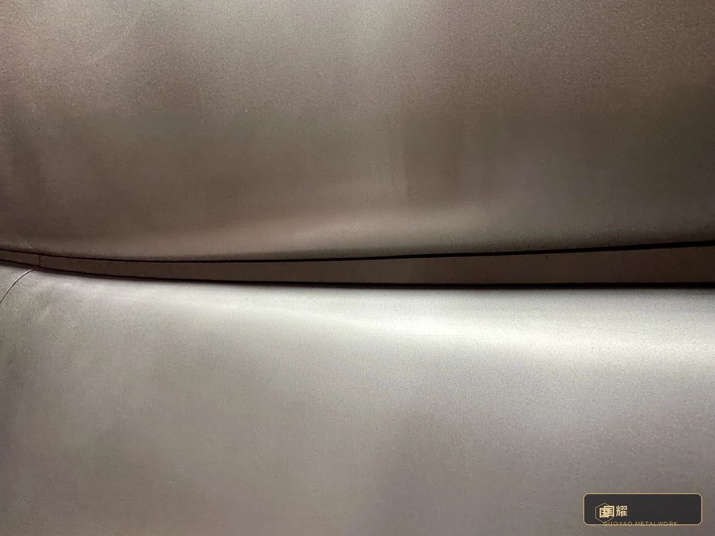 Seam line running across the curved surface