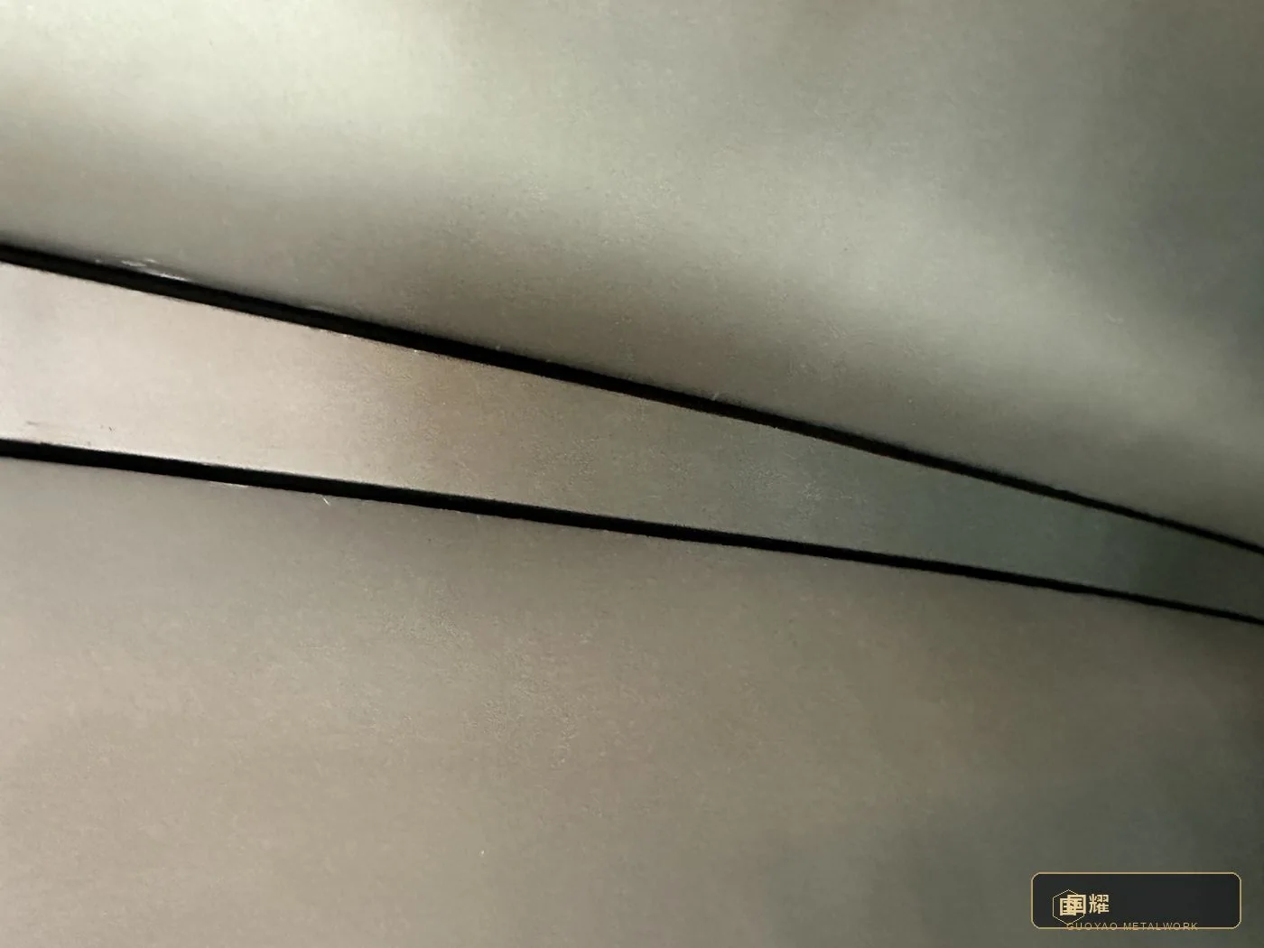Surface and seam in warm workshop light