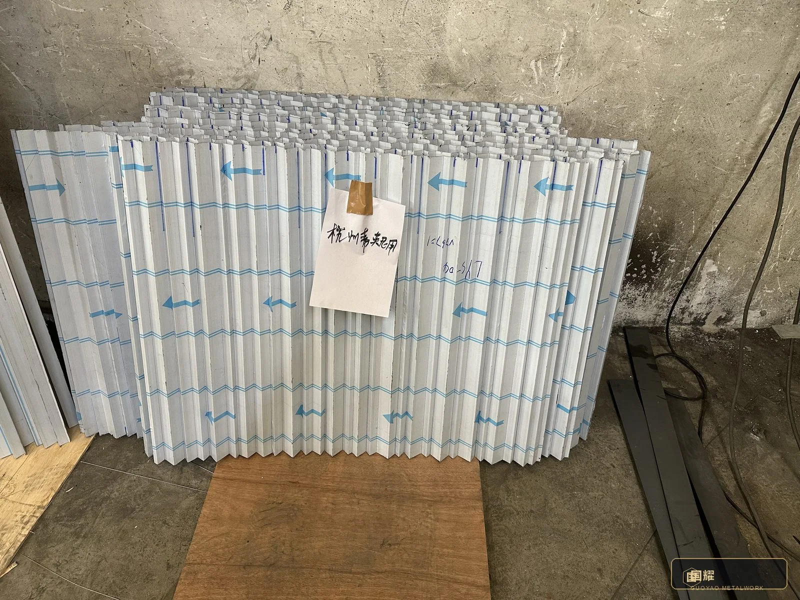 Completed panels wrapped and staged in fabrication sequence.