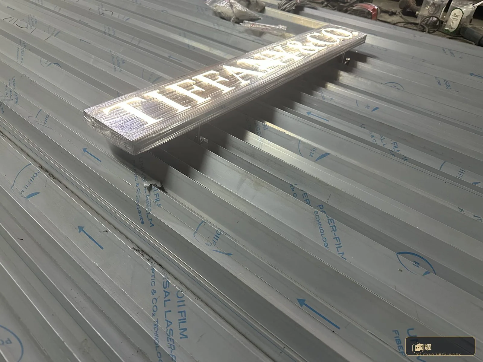 The glow test: face membranes lighting evenly across the row, brightness balanced by measurement.