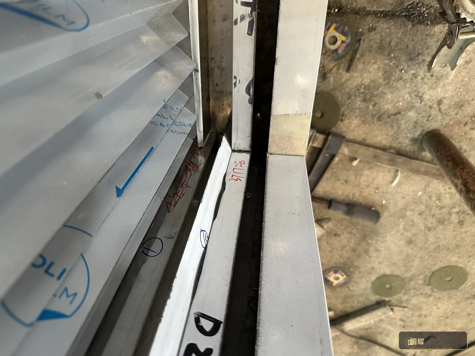 A corner junction inspected at close range — the joint that customers touch with their eyes first is the one inspected last and longest.