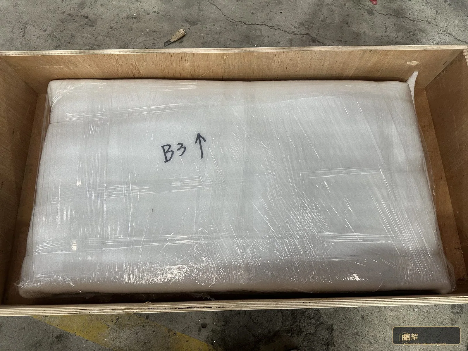 A sealed carton marked for the site — consumables, fixings and spares packed against the installation method statement.