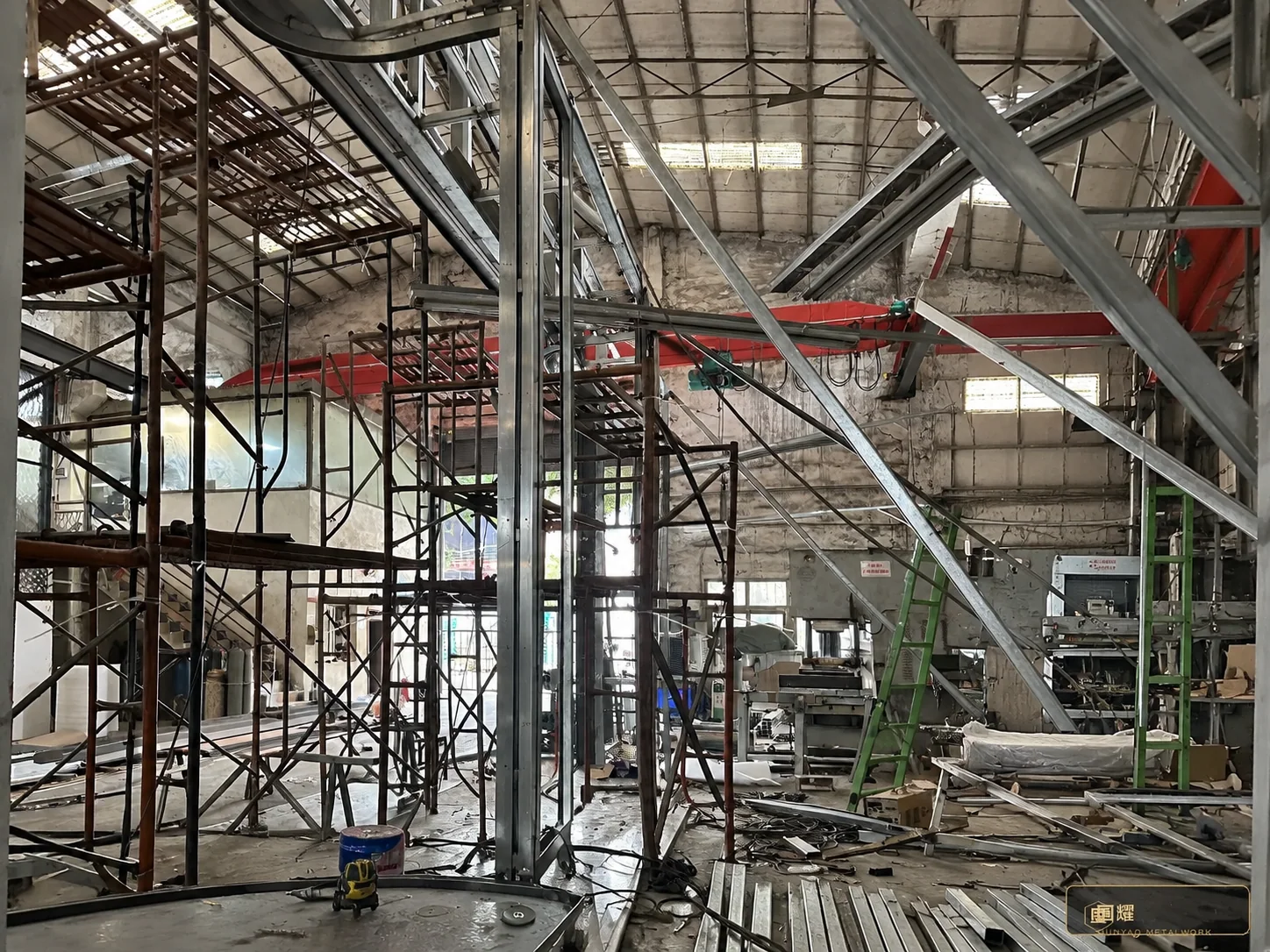 A full-height bay standing plumb at the rig, alignment shims set — the sequence now rehearsed end to end.