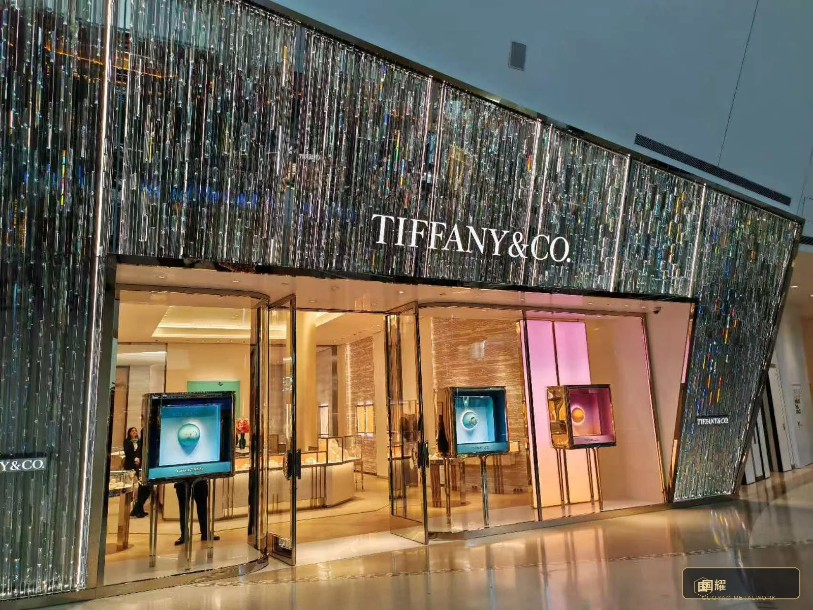 The finished boutique under the canopy, trading — the facade reading exactly as approved at the mock-up.