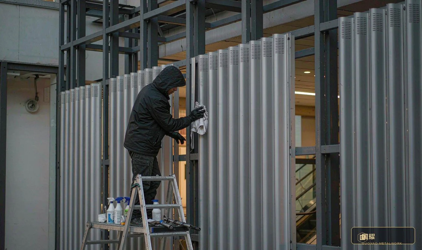 Aftercare in practice: seam cleaning and scheduled torque checks — the maintenance the facade was designed to receive.